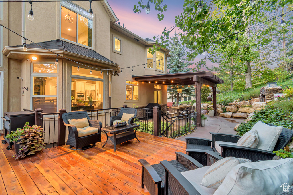 Deck at dusk with an outdoor hangout area