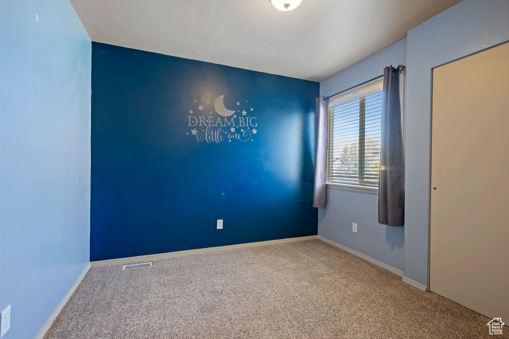 View of carpeted spare room