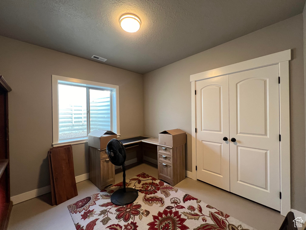 Office with a textured ceiling