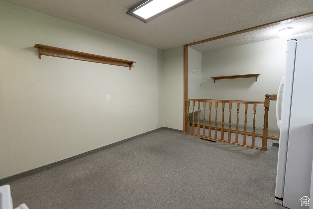 Spare room featuring light colored carpet