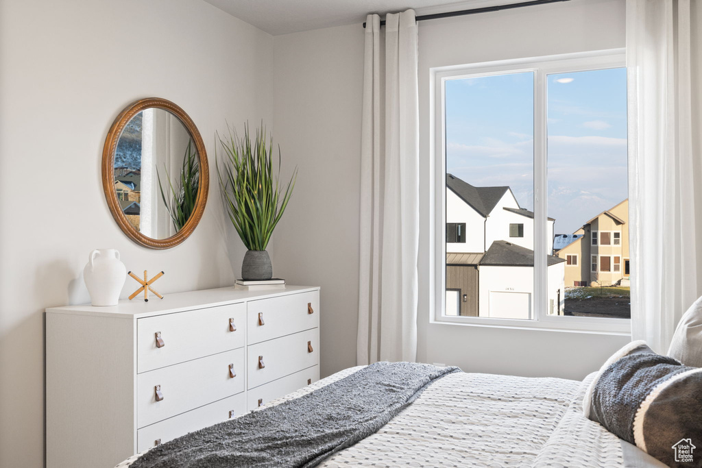 Bedroom featuring multiple windows