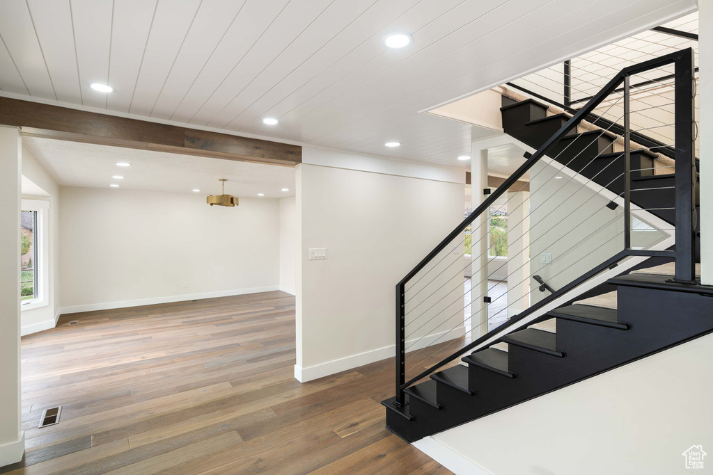 Stairs with hardwood / wood-style flooring