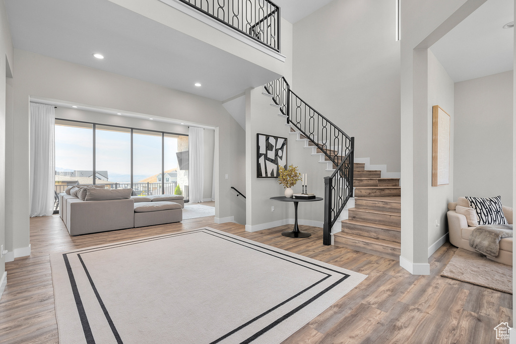 Entrance foyer with hardwood / wood-style flooring