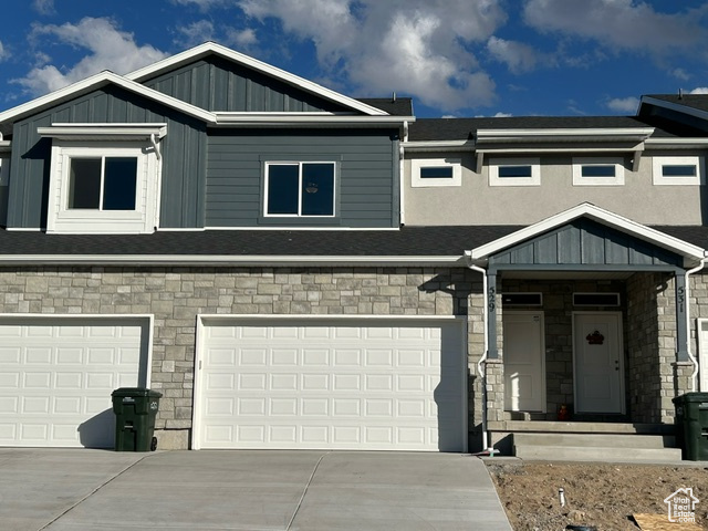 Craftsman-style house featuring a garage