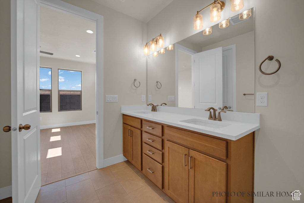 Bathroom featuring vanity and hardwood / wood-style floors