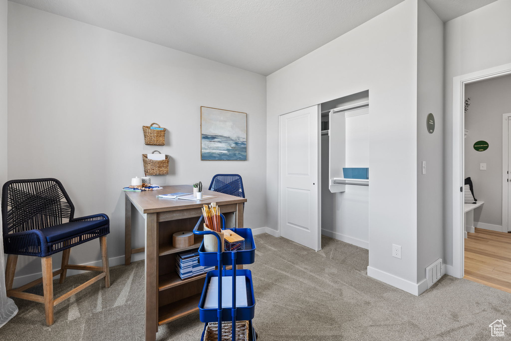 View of carpeted home office