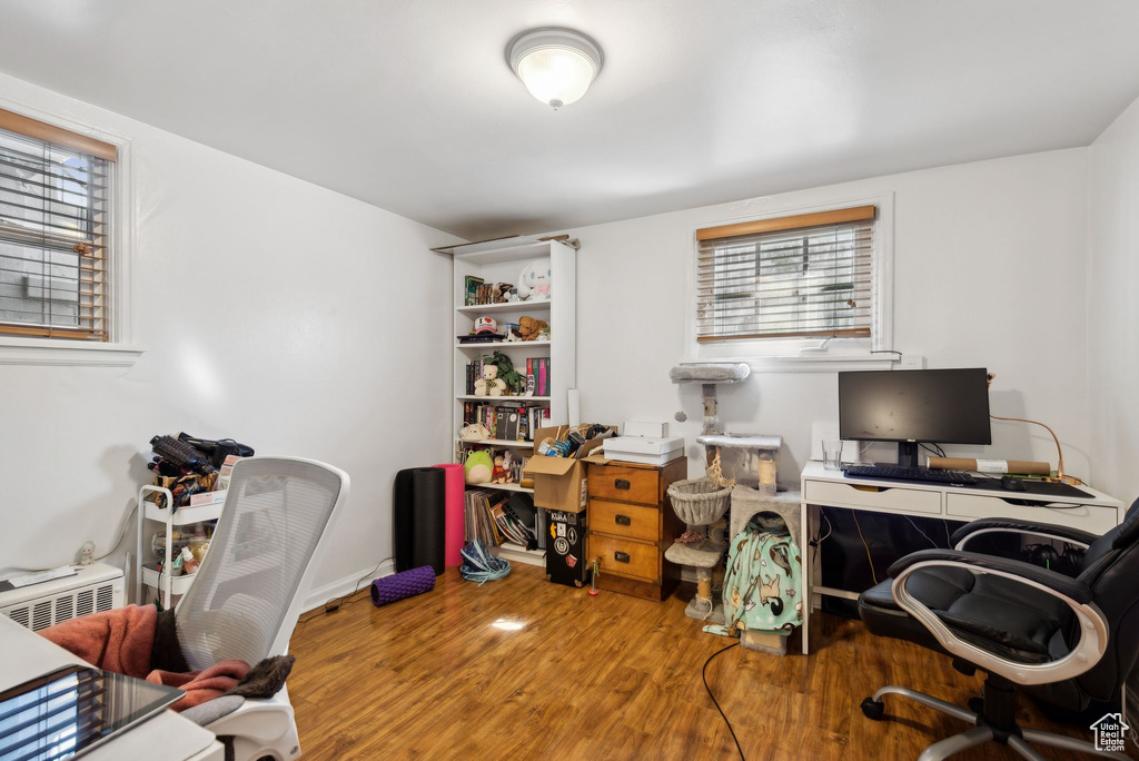 Office with wood-type flooring