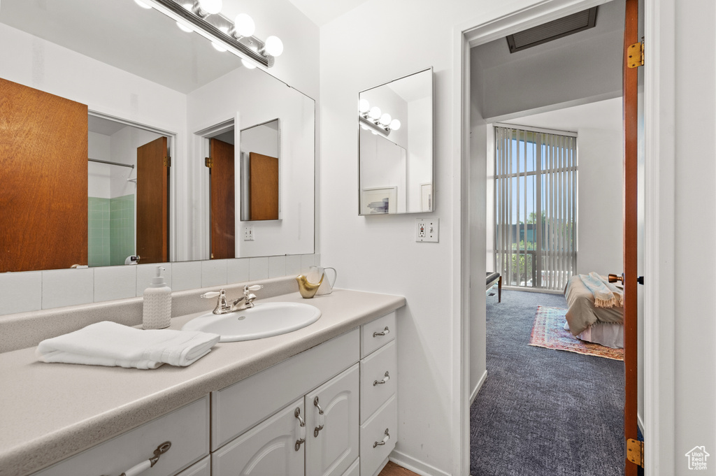 Bathroom with vanity and a shower with curtain