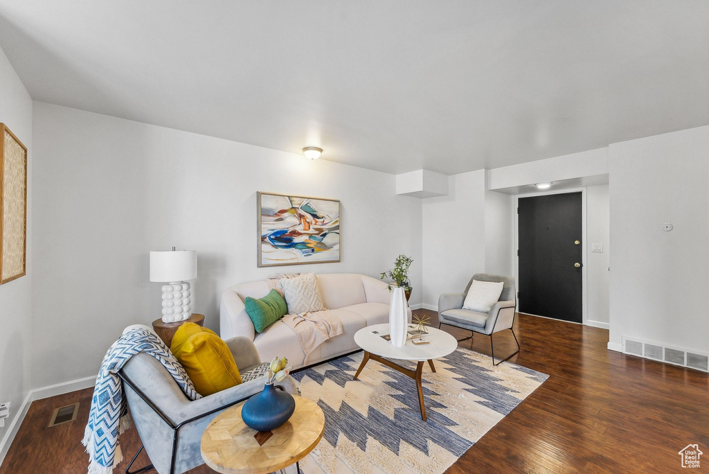 Living room featuring dark hardwood / wood-style floors