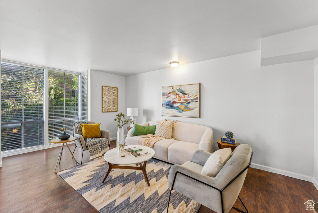 Living room with dark hardwood / wood-style floors