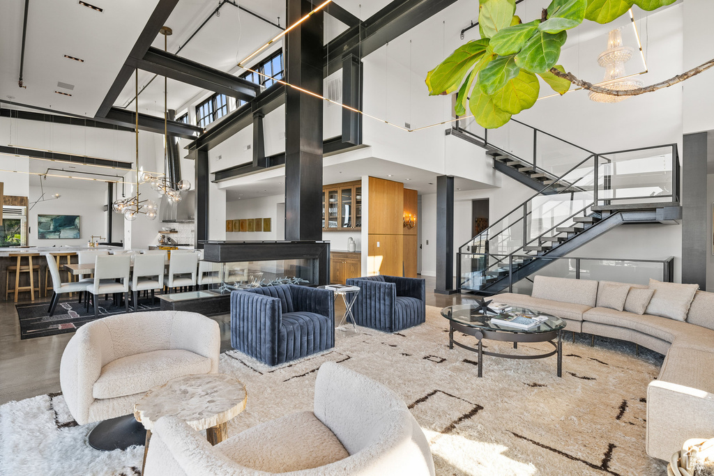 Community lobby featuring a towering ceiling and stairs