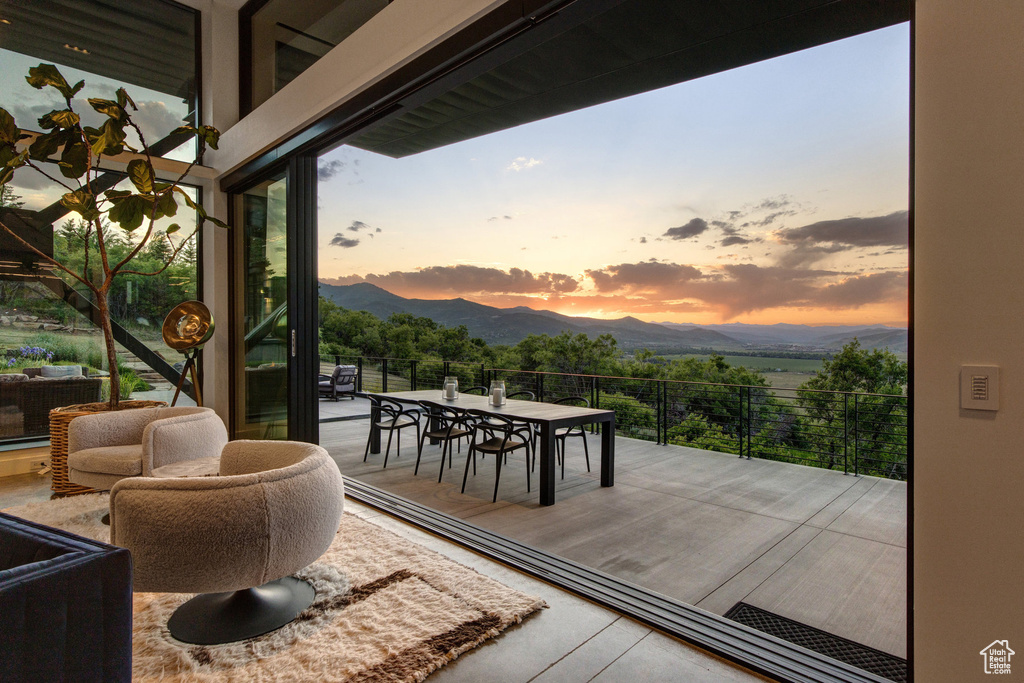 Wooden terrace with a mountain view and outdoor dining area