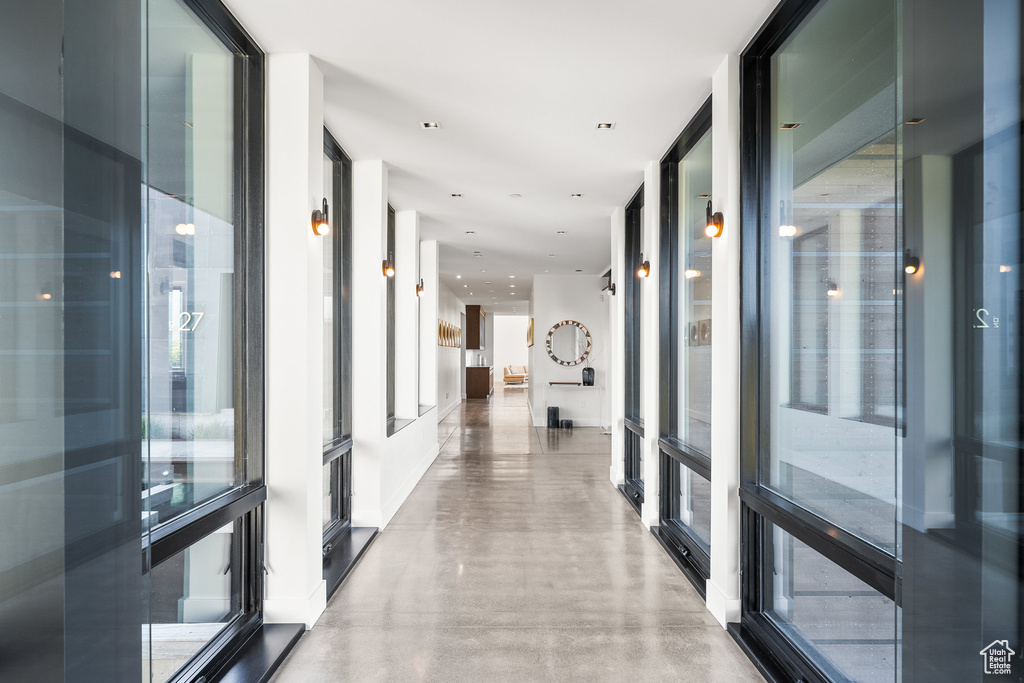 Corridor featuring finished concrete floors