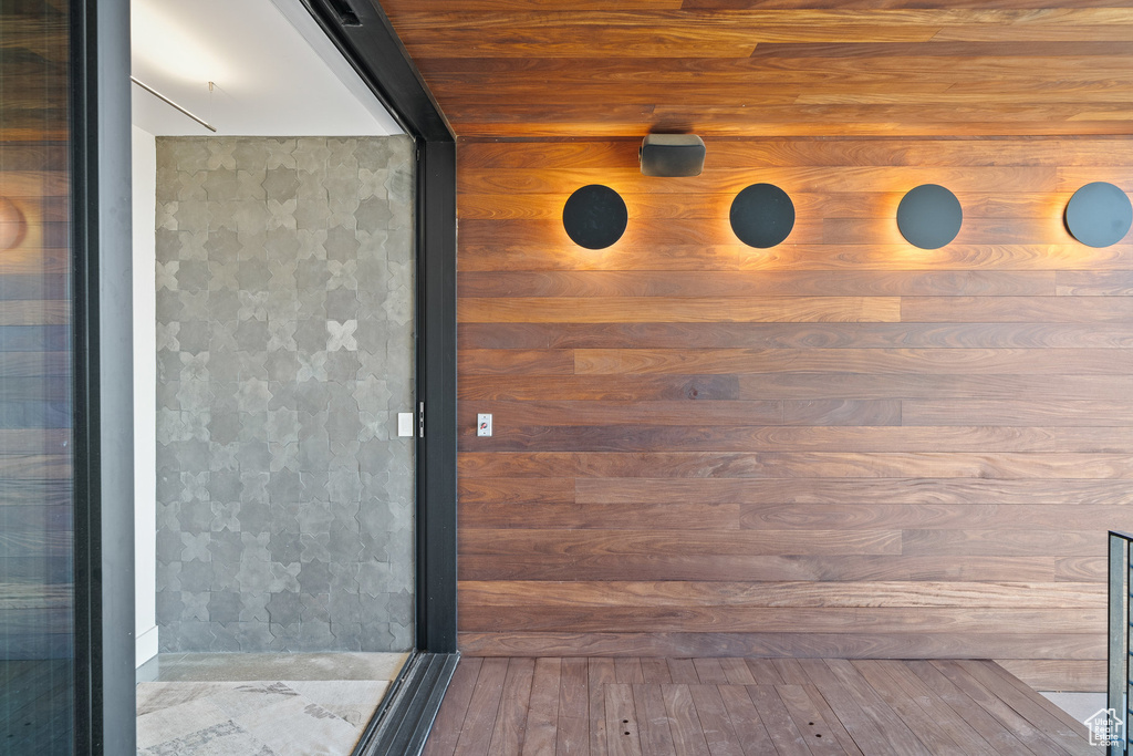Bathroom featuring wood-type flooring and a shower