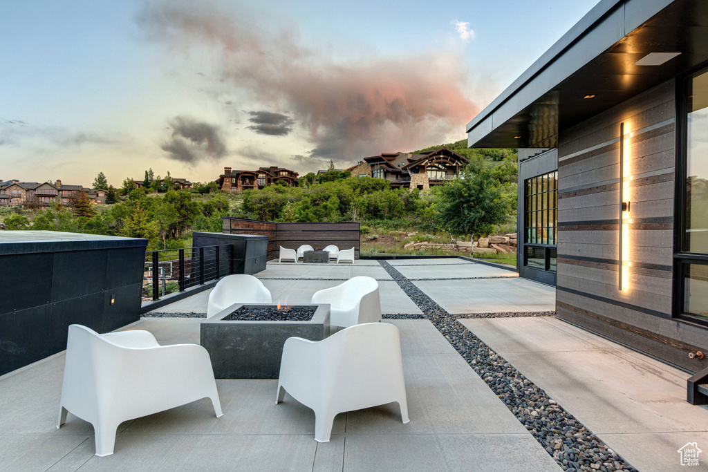 View of patio featuring a fire pit