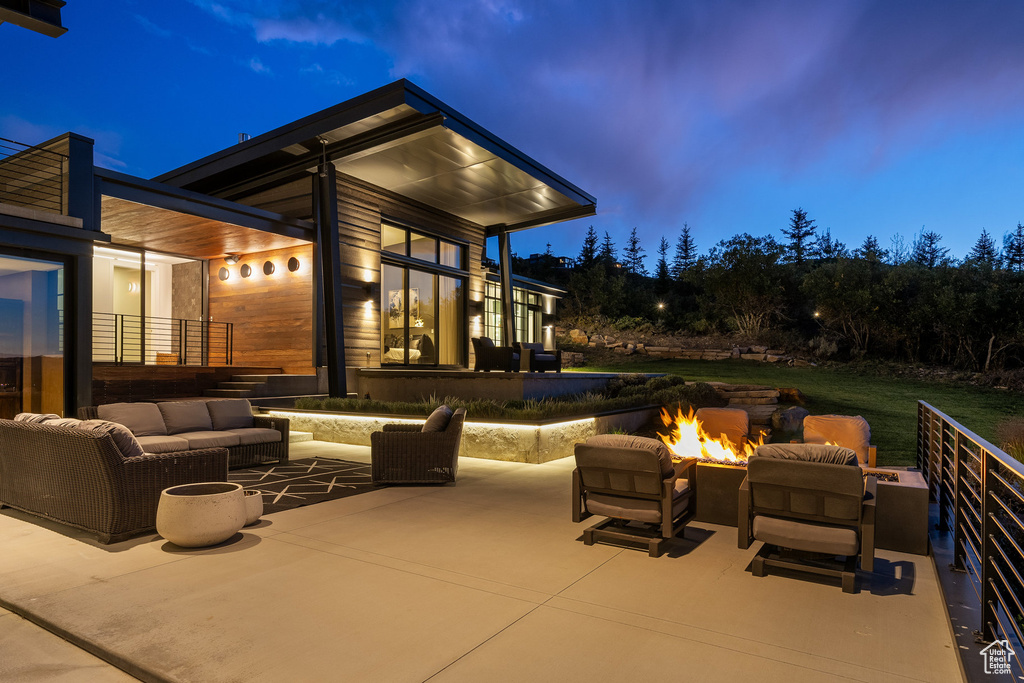 View of patio / terrace with an outdoor living space with a fire pit