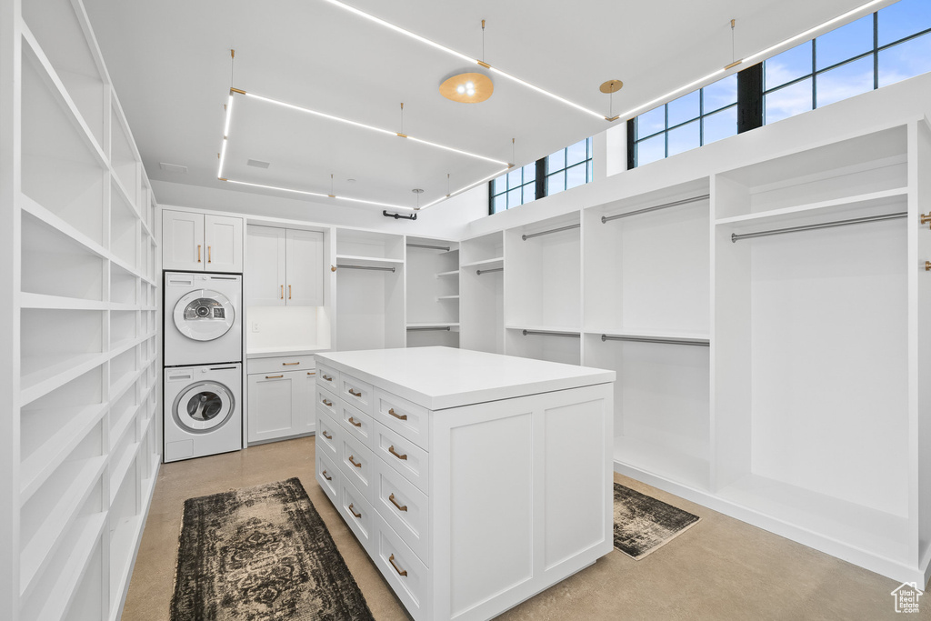 Spacious closet featuring stacked washer / drying machine