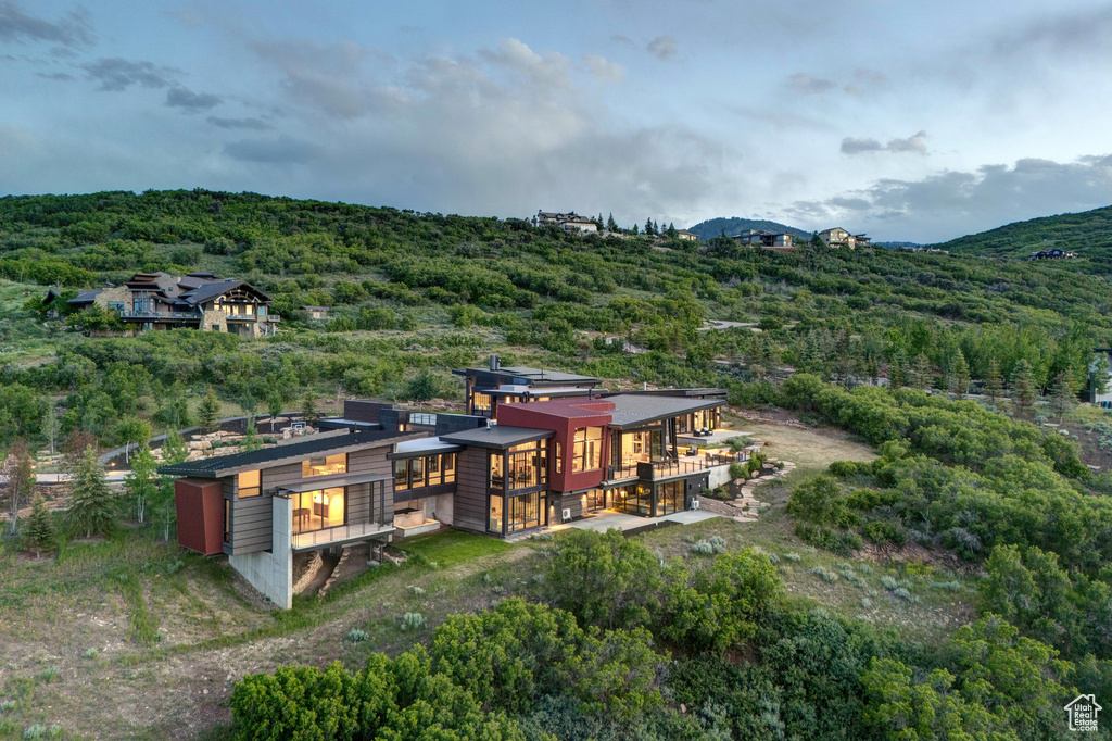Back of property featuring a forest view