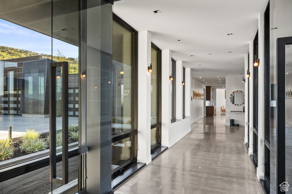 Hall featuring floor to ceiling windows