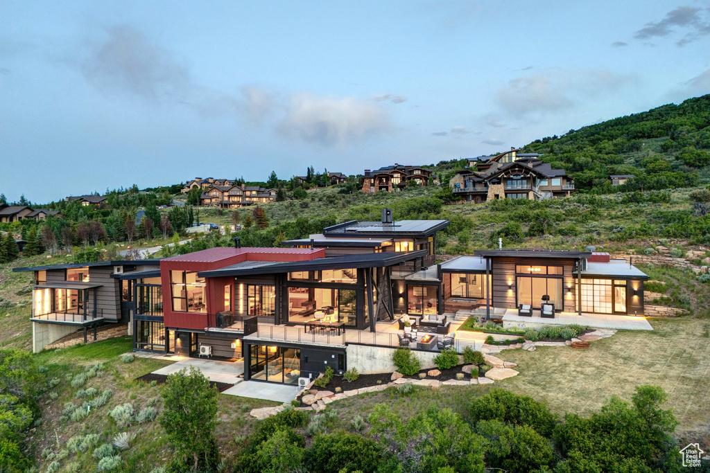 Back of property featuring a patio and a metal roof