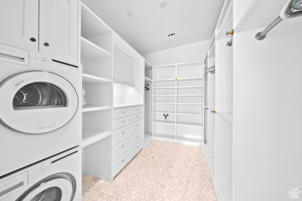 Laundry area with estacked washer and dryer