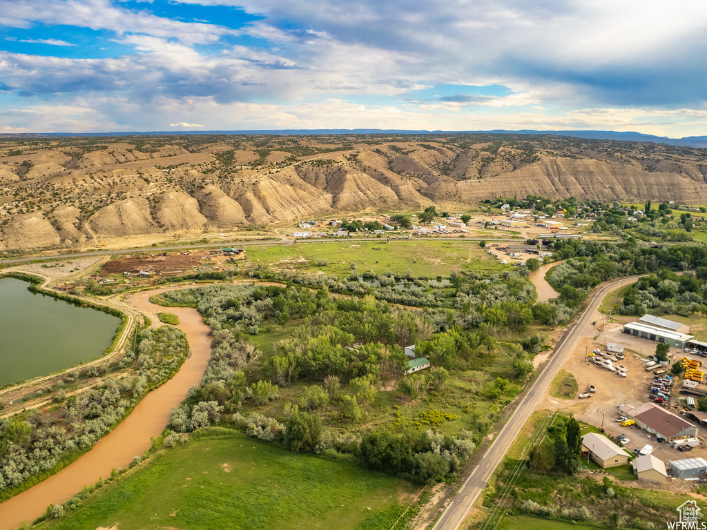 Drone / aerial view with a water and mountain view