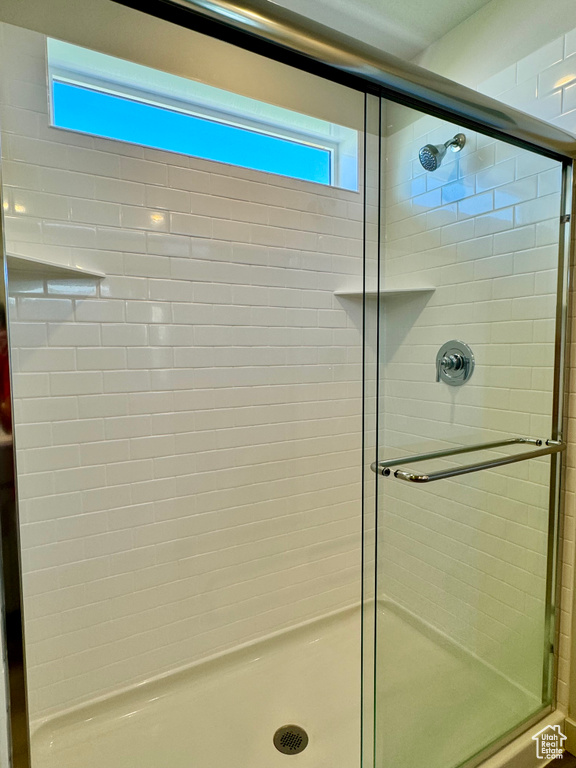 Bathroom with a shower with door