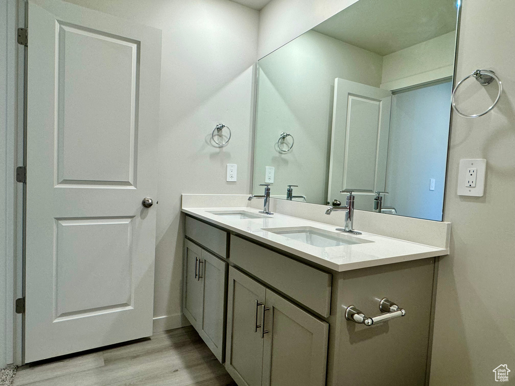 Bathroom featuring vanity and hardwood / wood-style flooring