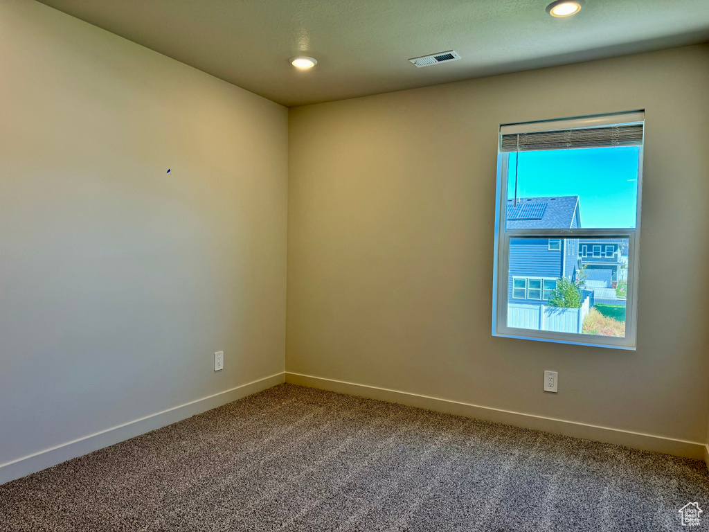 Empty room featuring carpet flooring