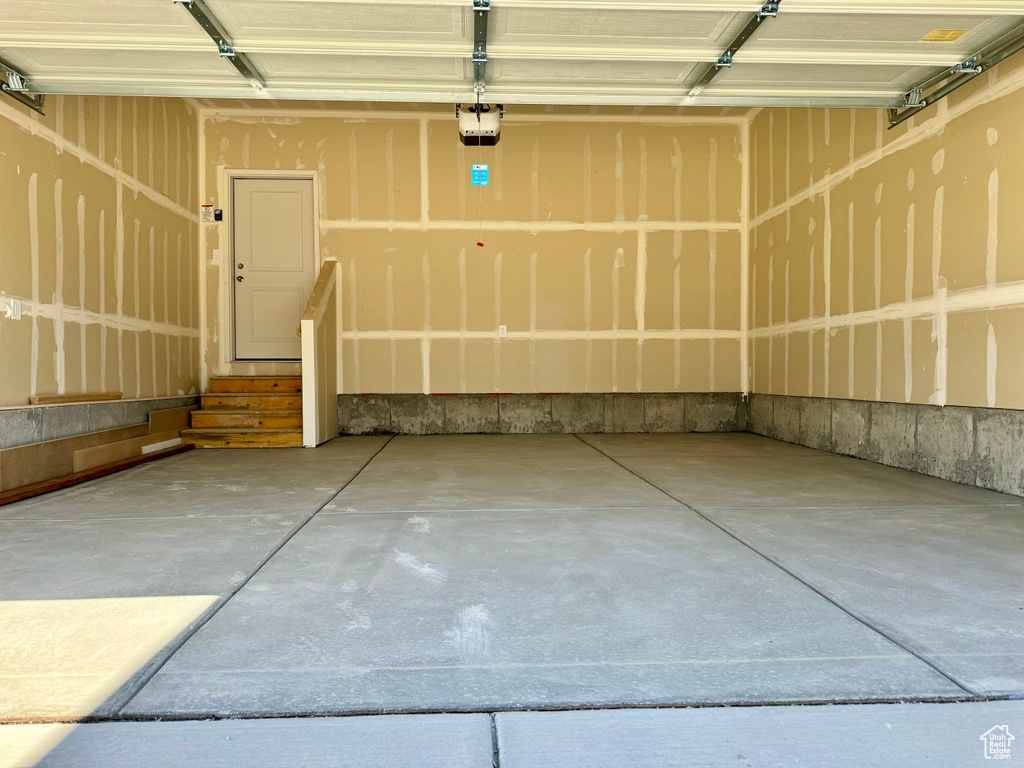 Garage featuring a garage door opener