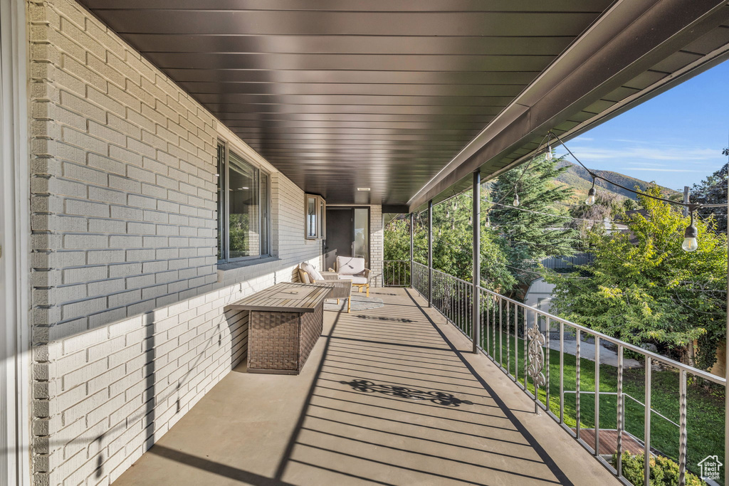 Exterior space with a balcony and a mountain view