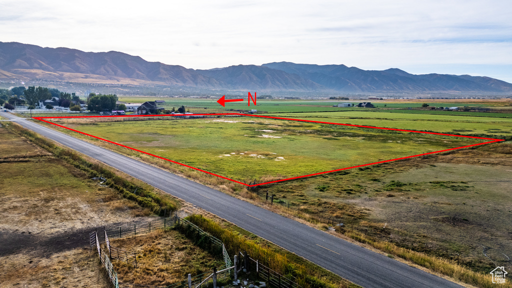 Property view of mountains with a rural view