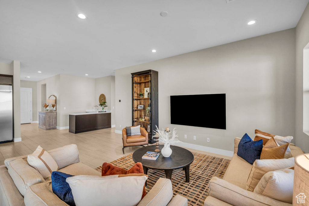 Living room with light hardwood / wood-style floors