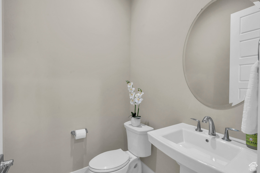 Bathroom with sink and toilet