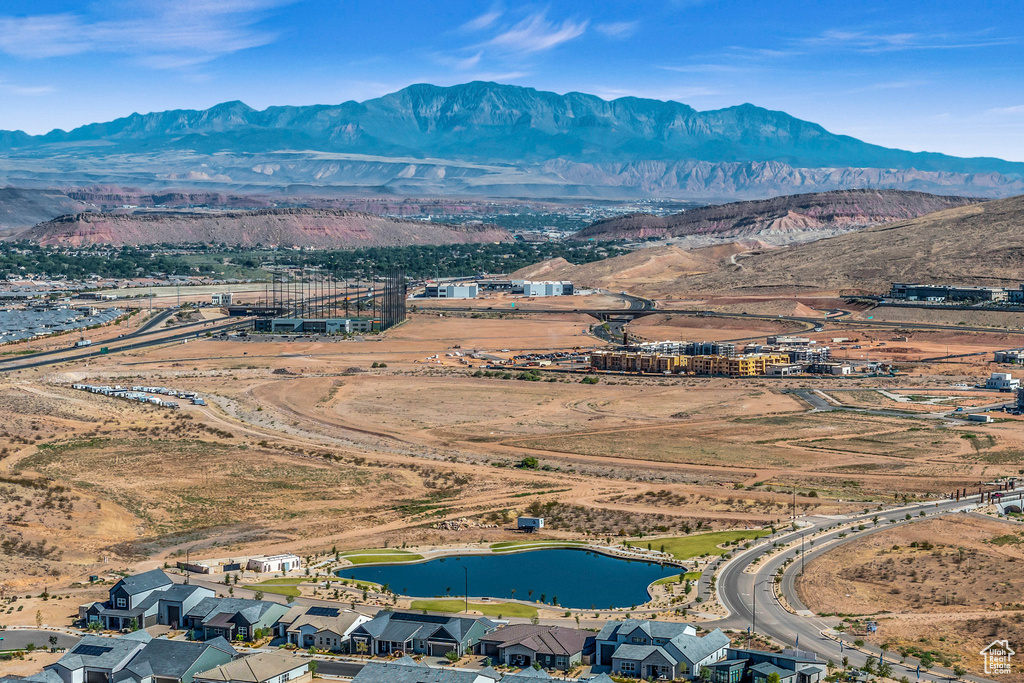 Drone / aerial view featuring a water and mountain view