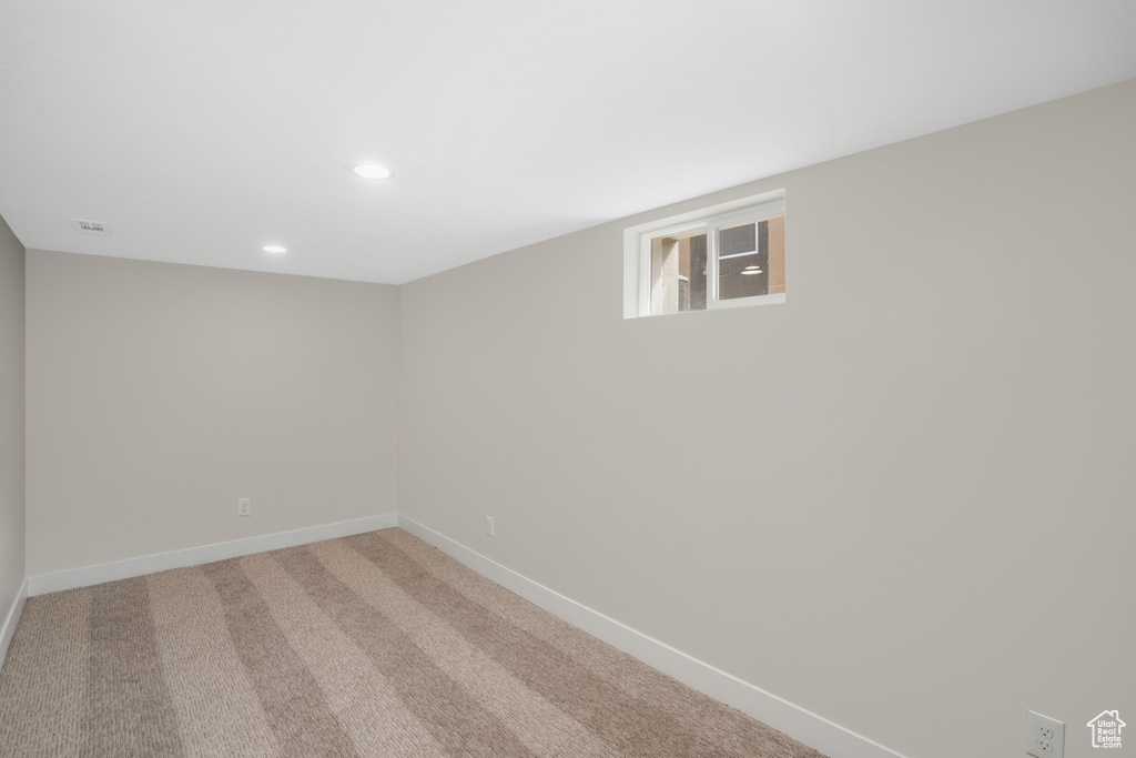 Spare room featuring carpet flooring