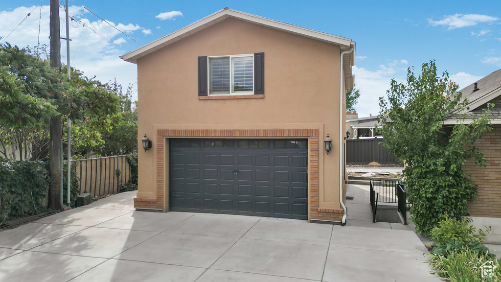 View of front of property featuring a garage