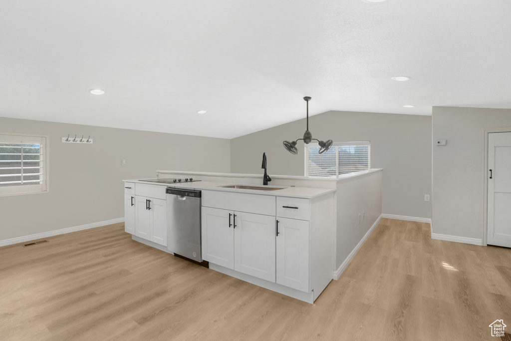 Kitchen with pendant lighting, dishwasher, plenty of natural light, and sink