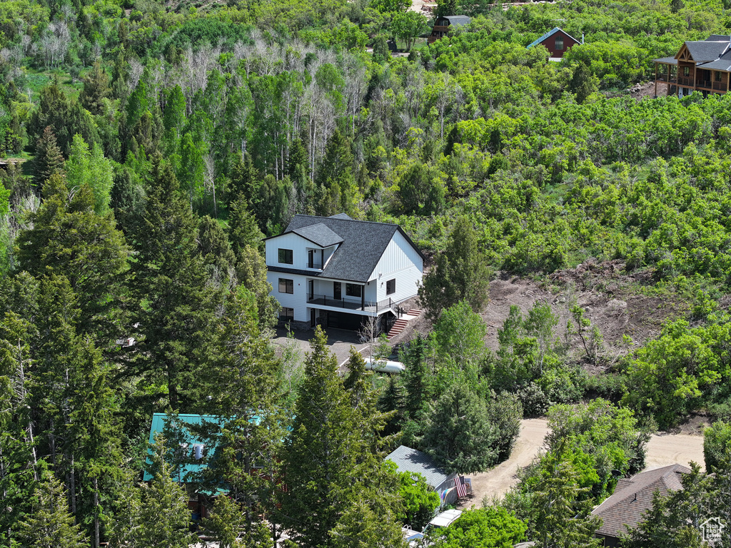 View from above of property featuring a forest