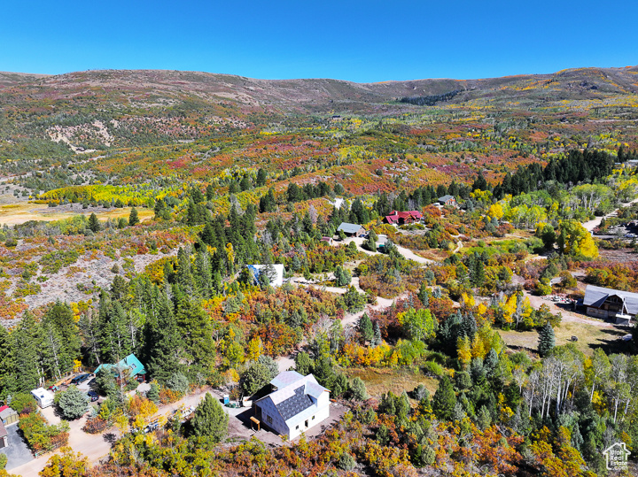 Birds eye view of property with a mountain view