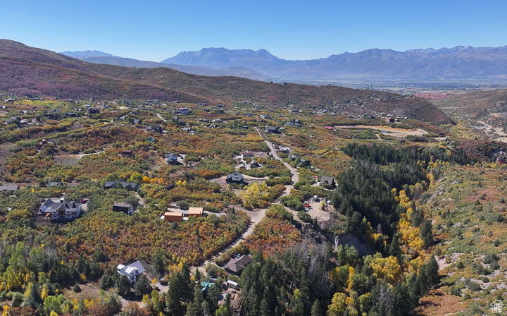 Birds eye view of property with a mountain view