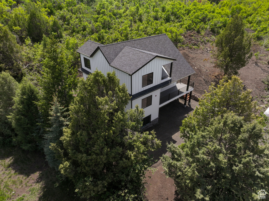 View from above of property featuring a forest