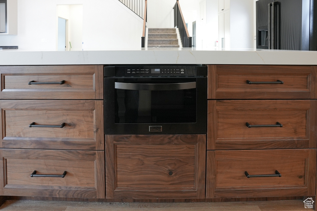 Kitchen with high end refrigerator and oven