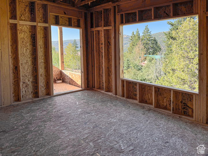 Empty room featuring a mountain view