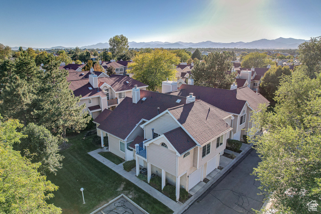 Birds eye view of property with a mountain view