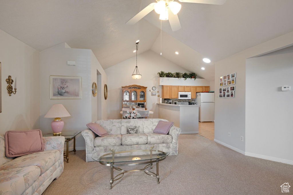 Living room with light carpet, lofted ceiling, and ceiling fan