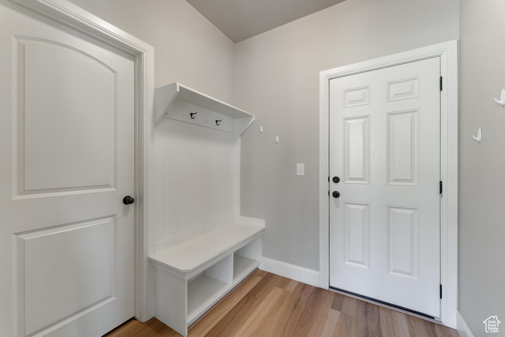 Mudroom with wood-type flooring