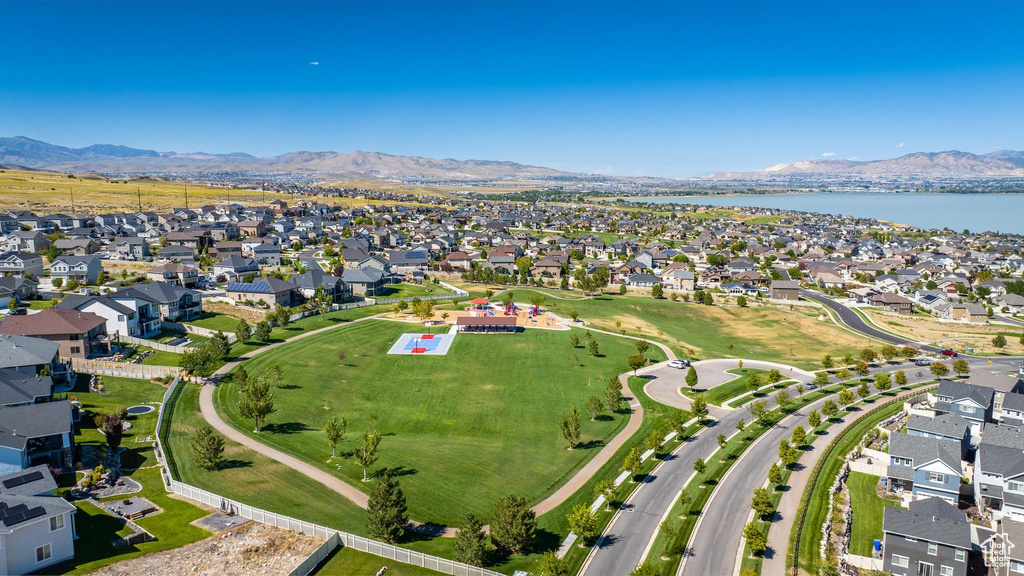 Birds eye view of property featuring a water and mountain view