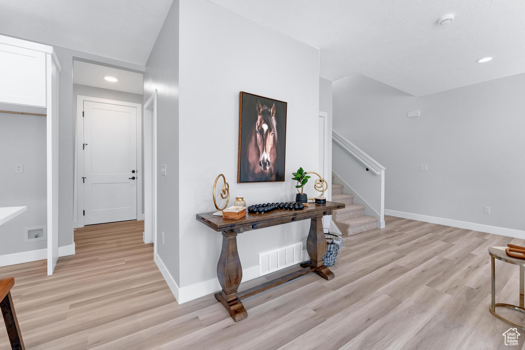 Corridor featuring light hardwood / wood-style flooring