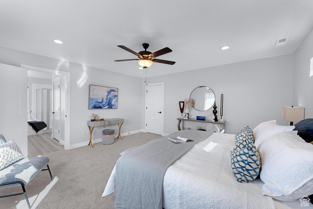 Bedroom featuring ceiling fan and light colored carpet